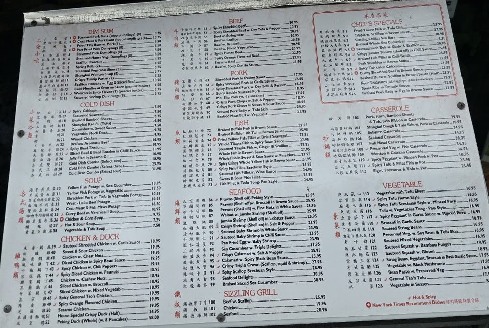 Printed menu beside a tea cup.
